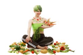 kobieta z pękiem warzyw w ręce